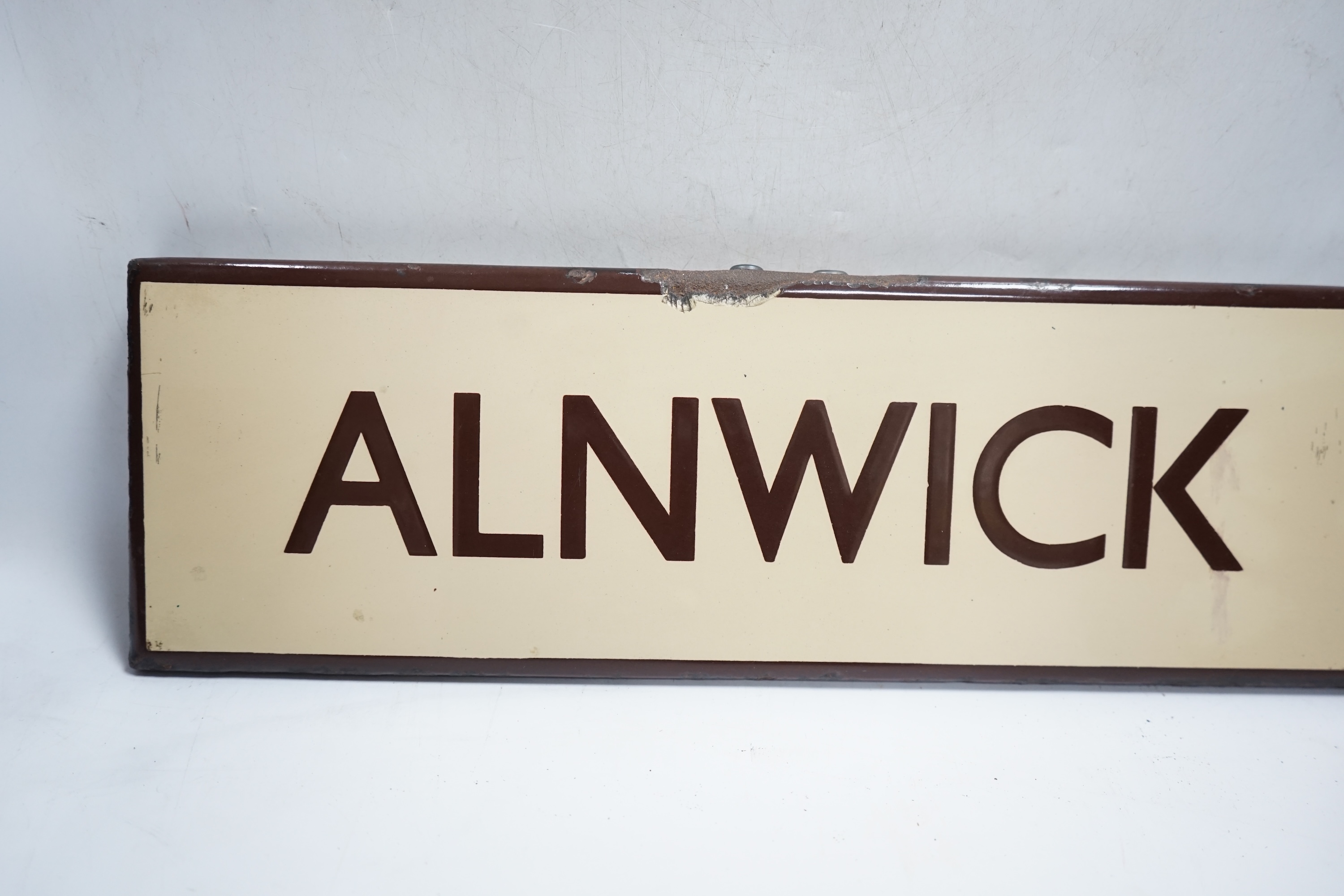 A London & North Eastern Railway enamel lamp tablet for Alnwick. Condition - fair to good.